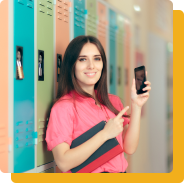 Woman leans against lockers holding a phone